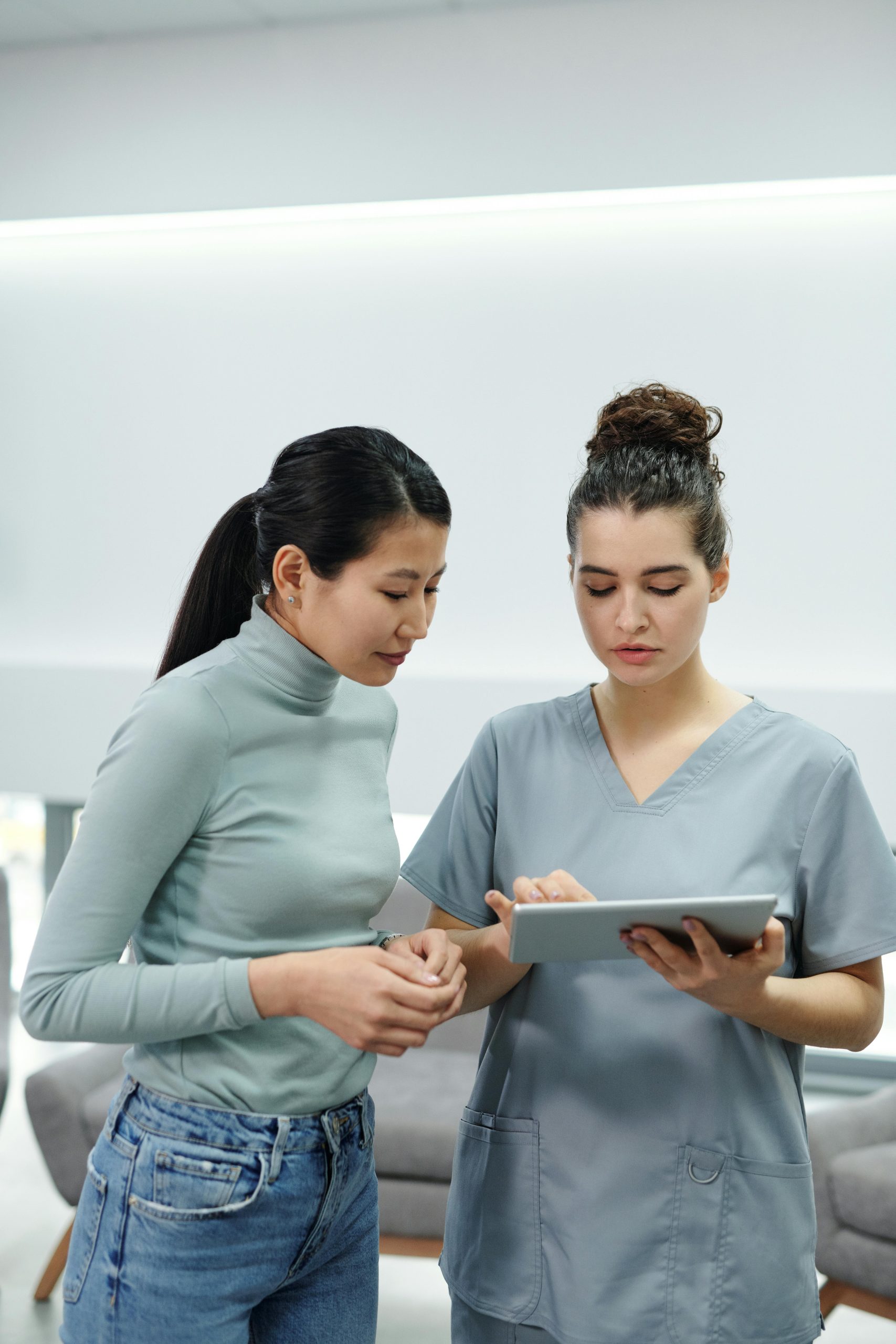Two women looking at tablet